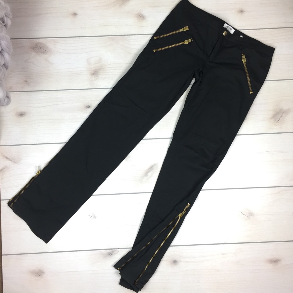 Moschino black rock and roll flare pants.